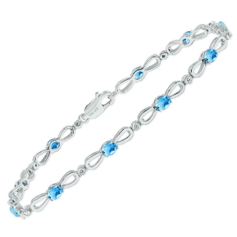 Blue Topaz And Natural Diamond Ribbon Loop Bracelet In .925 Sterling Silver